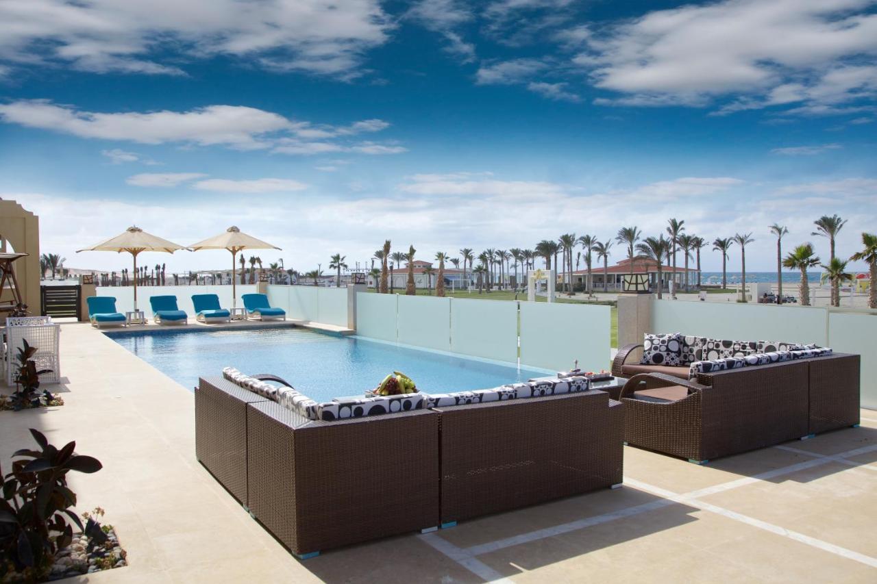 Rixos Alamein - Full Board Plus El Alamein Esterno foto The pool at the Hilton Sharm El Sheikh