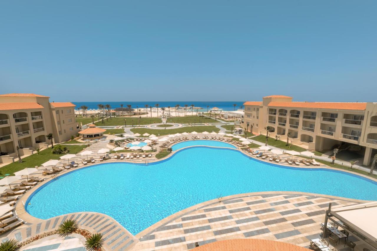 Rixos Alamein - Full Board Plus El Alamein Esterno foto A pool at a resort in Egypt